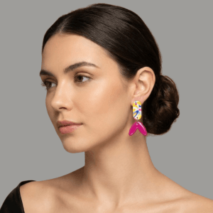 Side view of Sugarplum handmade polymer clay earrings with glossy resin finish and stainless steel posts.